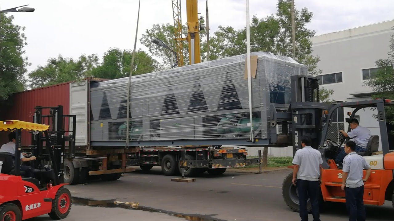 A large SPM chiller unit being craned and loaded for shipment to site